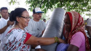 6f.SSSION VOlunteers distributing relief materials  
